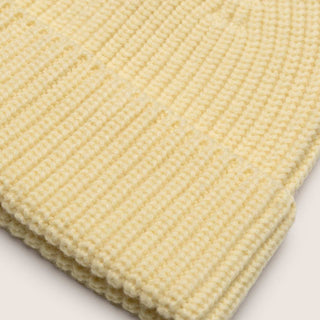 Close up view of Bambi Custard yellow knit beanie