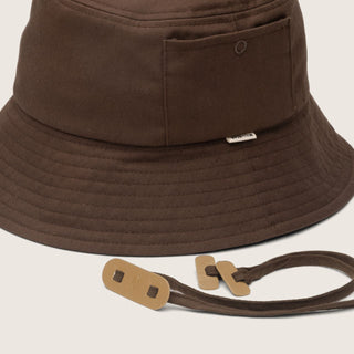 Close-up of a brown string bucket hat side profile