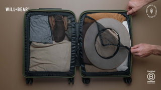 Hat packed neatly in the a suitcase which is open