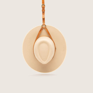 Front view of tan leather hat holder travel strap