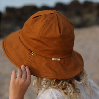 Close up image of kids orange bucket hat little lenny rust