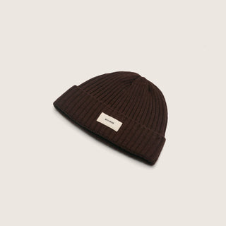 Flat lay of the Levi Dark Brown beanie made from wool, displayed on a neutral background