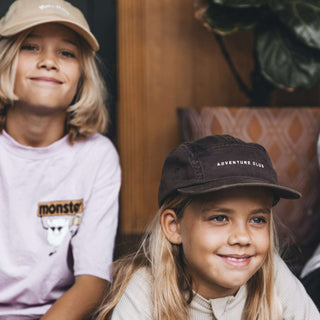 Girl wearing Little Archie Walnut kids hat