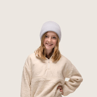 Girl having fun wearing Little Bambi Dust Blue knit beanie