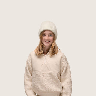 Girl wearing Little Bambi Sage knit beanie