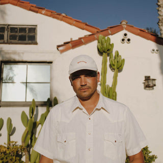 Man wearing the Riley Bone baseball cap