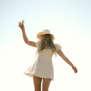 Women wearing white cream bucket hat