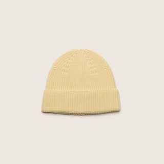 Top view of the Will & Bear Bambi Custard yellow merino wool beanie showcasing its knitted texture.