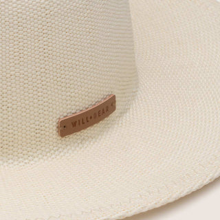 Detail view of the Will & Bear Calloway Bone white straw felt fedora featuring the woven texture and embossed logo.