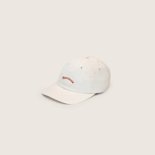 Side View of Will & Bear Little Riley Bone Kids White Cap – Soft Cotton Cap for Children with Embroidered Logo on Neutral Background.