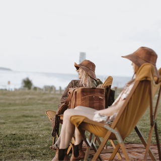Group of friends seated in Will & Bear x Wandering Folk Slow Road Camp Chairs during a relaxed outdoor hangout.