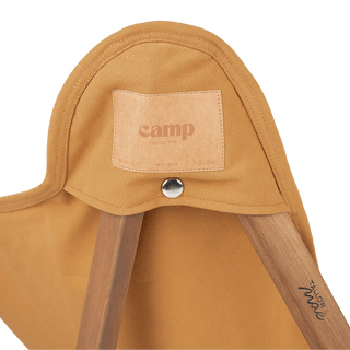 Close-up detail of the Will & Bear x Wandering Folk Slow Road Camp Chair showing leather logo patch and sturdy stitching.