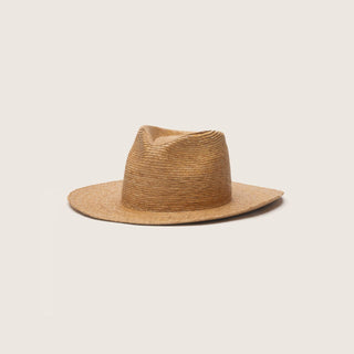 Tan straw Zuri hat in side view on a plain light background, showing teardrop crown and wide brim.