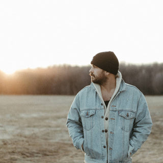 Man wearing Will & Bear Aus Wool Beanie during sunset outdoor adventure, built for rugged Australian conditions