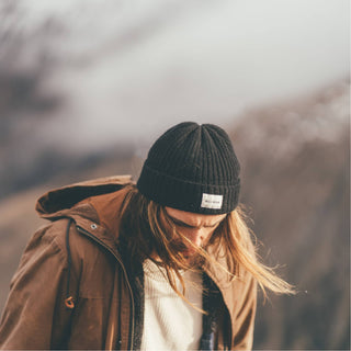 Woman wearing Will & Bear Aus Wool Beanie, perfect for outdoor hikes and winter escapes