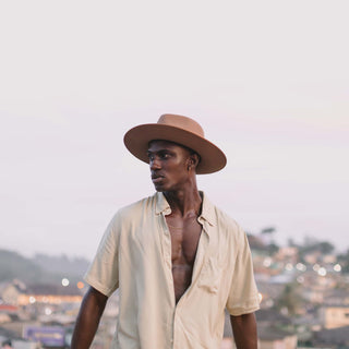 Man wearing Will & Bear Brown Wide Brim Fedora during sunset outdoor adventure