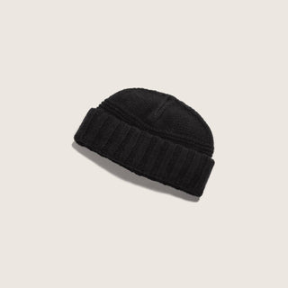 Will & Bear Doc Black Wool Fisherman’s Beanie on neutral background, showcasing ribbed knit design and deep black tone.