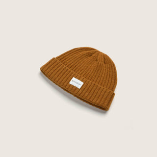Will & Bear Levi Mustard Wool Beanie on a neutral background, featuring ribbed knit texture and branded front label.